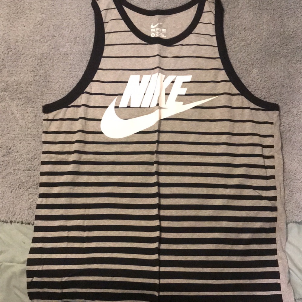 Lot of 13 men’s tank tops. Large and XL in size.